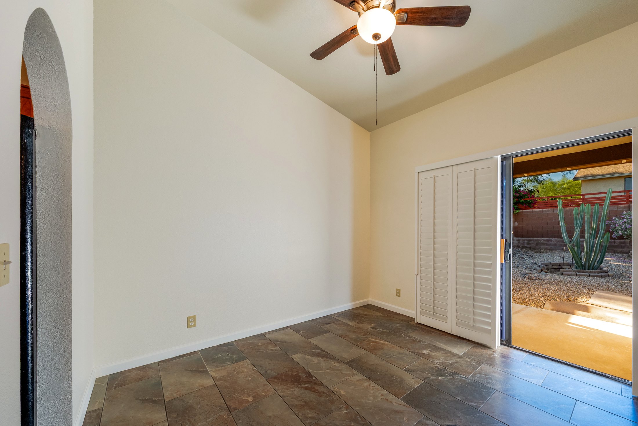 Vaulted room opening to the rear patio and saguaro.