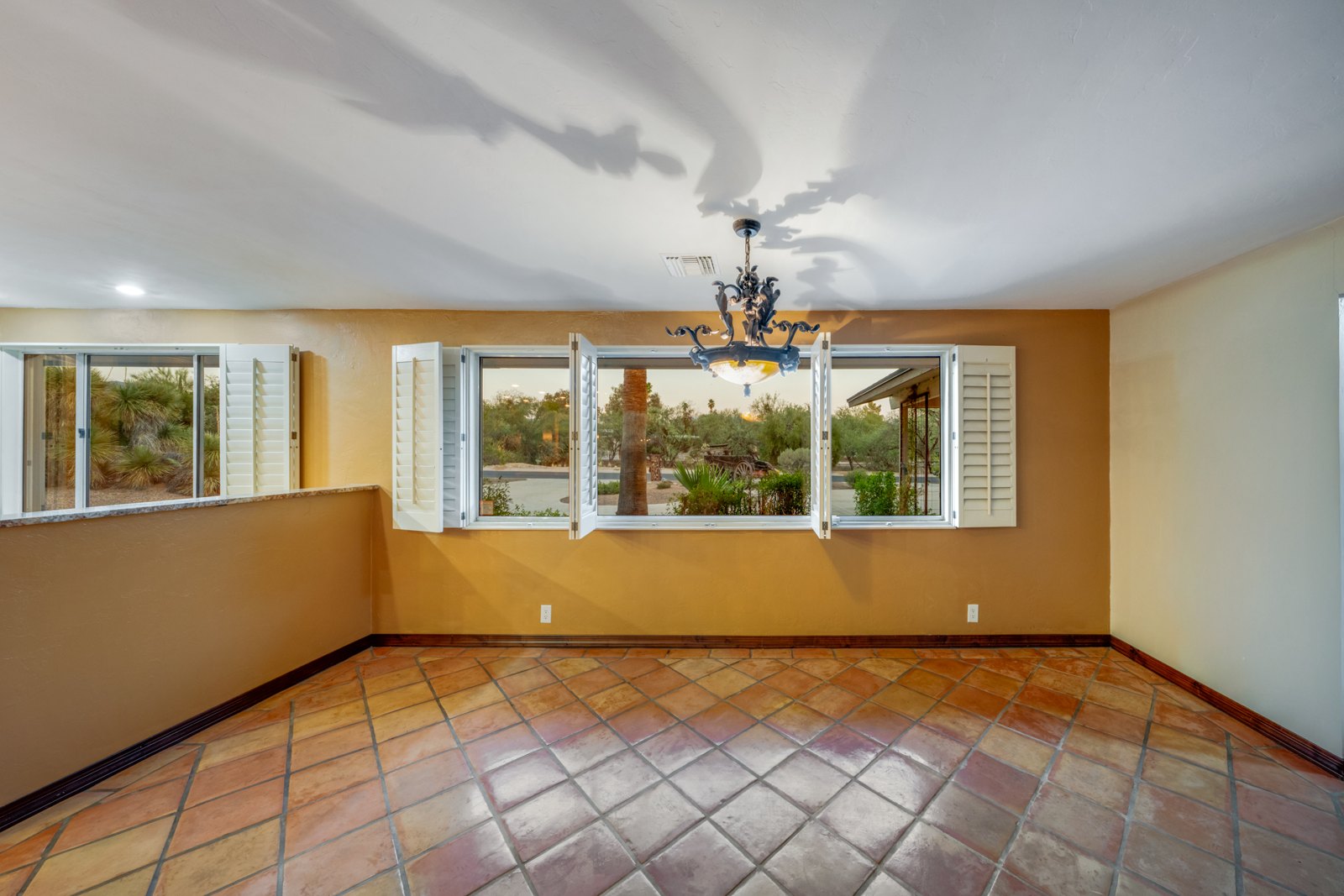 Unfurnished sitting area with windows on two sides