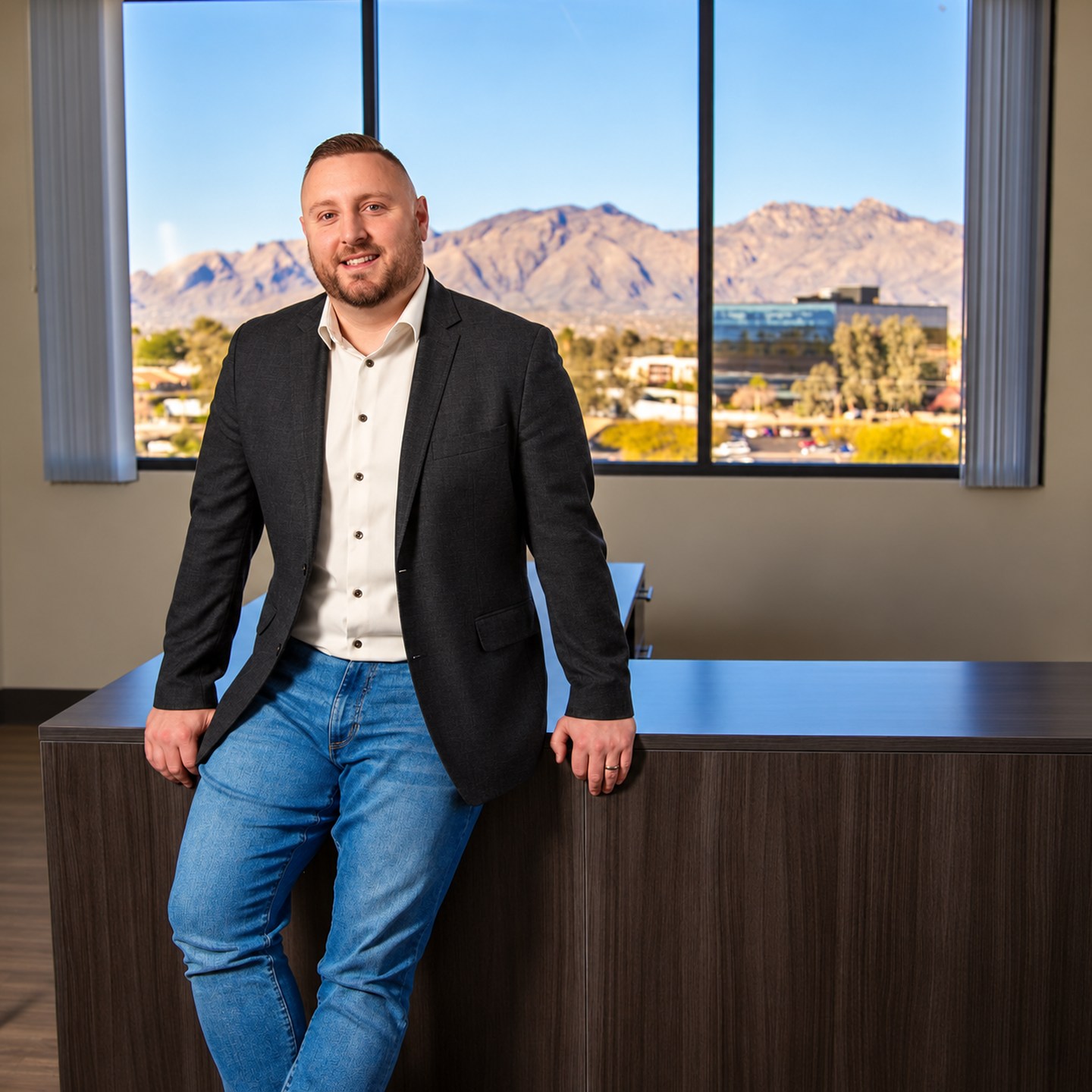 ZACH MOONEY in his office, edited from the supplied photograph